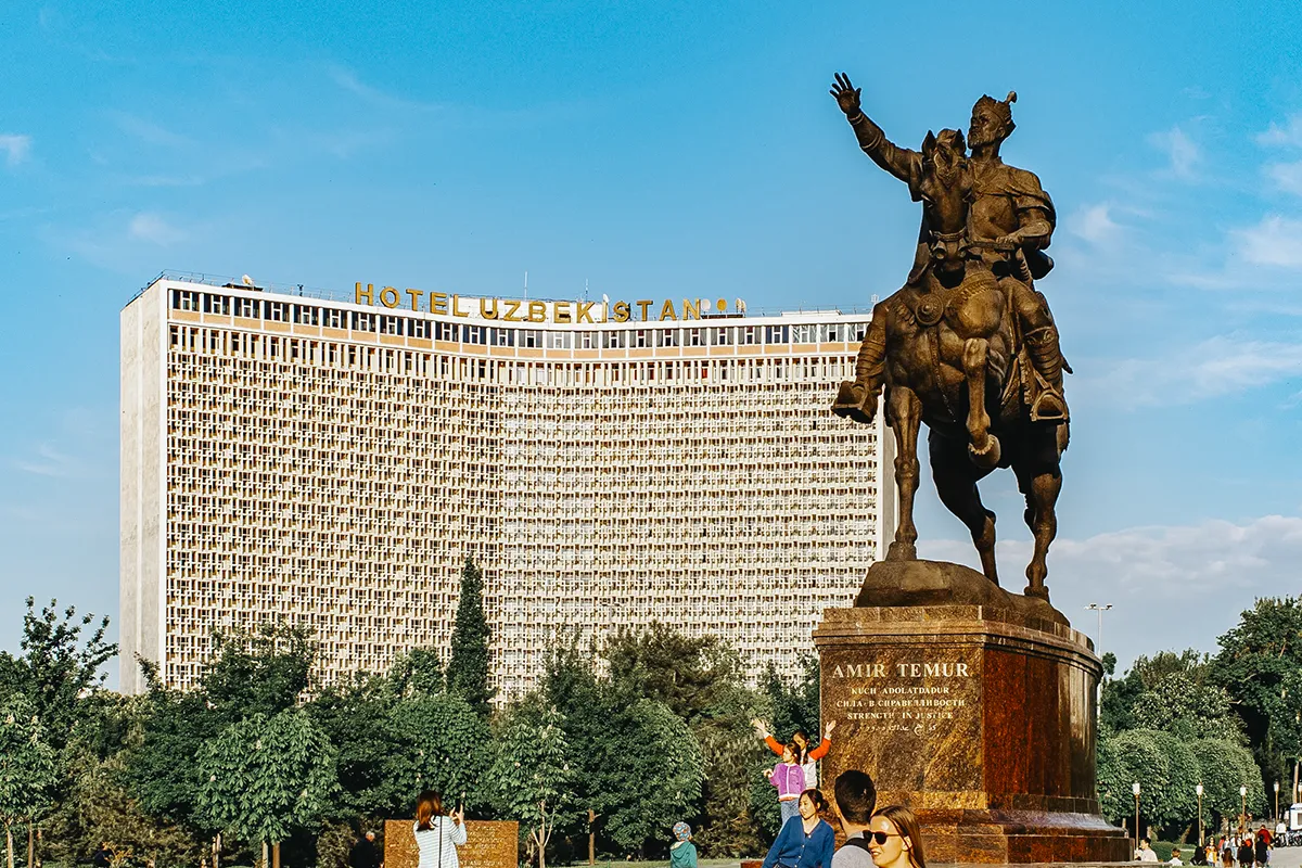 Amir Timur statue in Tashkent with Hotel Uzbekistan building in the background